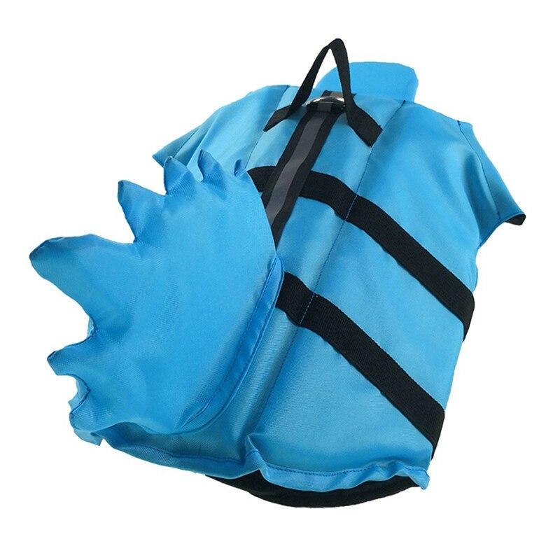 Blue dog life vest with a shark-fin back, adjustable black straps and top handle.